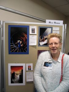 Helen with Floodtide artwork from Alex's art display.